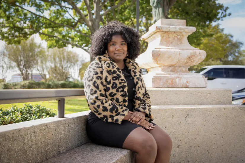 Maya Francis, who was on unemployment assistance for much of the pandemic, stands outside her current place of employment in Sugar Land on Wednesday.