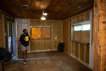 Sandra Edwards walks through her home in Houston’s Fifth Ward, still being rebuilt after heavy damage from Hurricane Harvey in 2017.