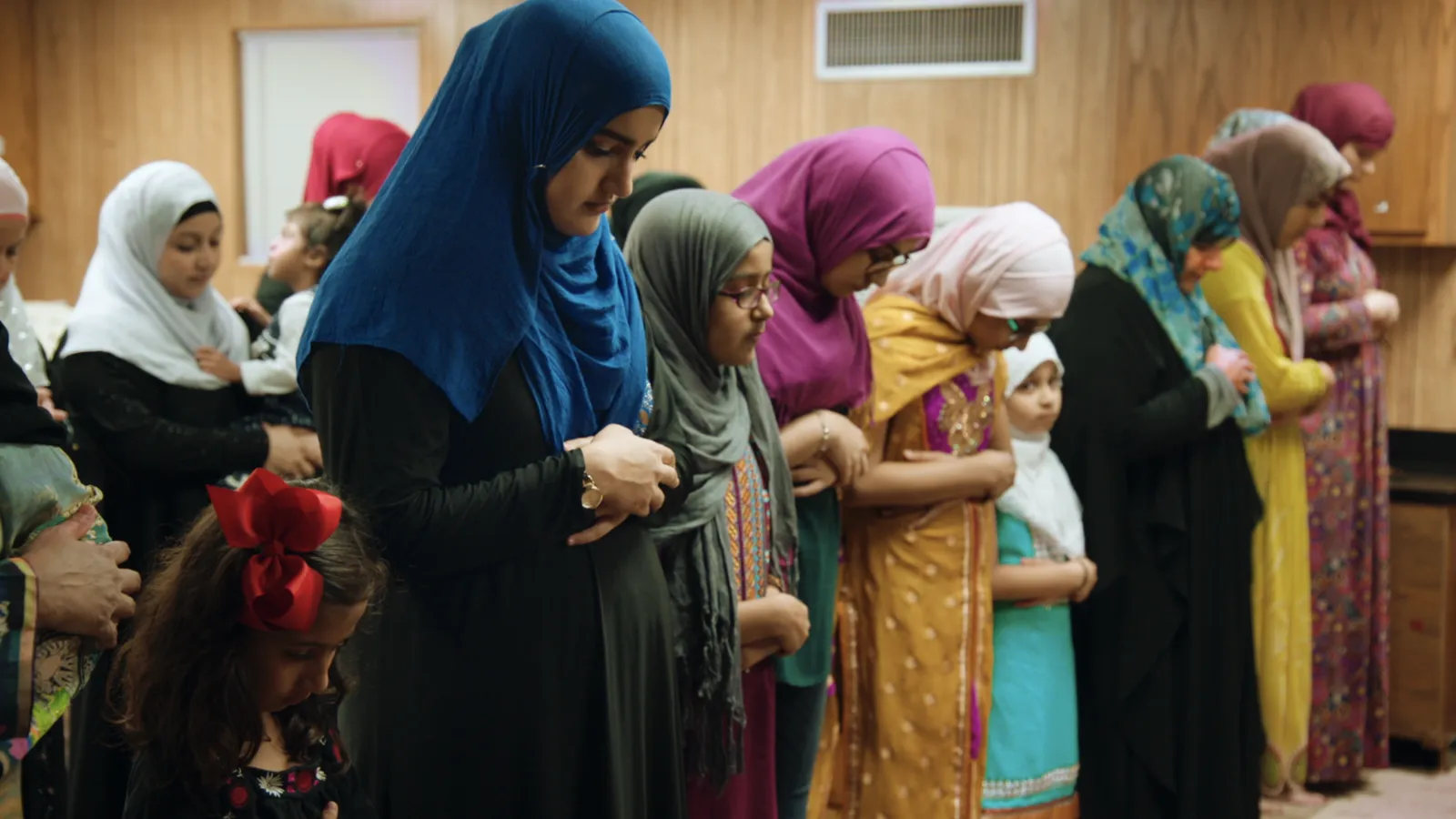 Veiled Women pray in the Victoria Islamic Center