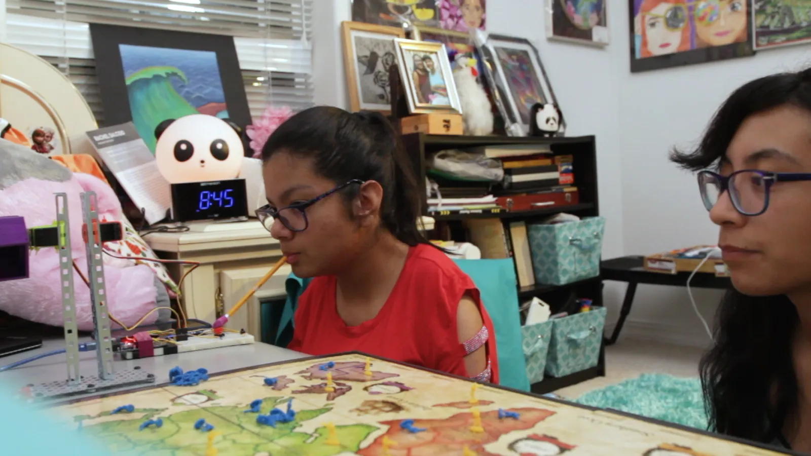High school best friends Shelly and Wendy play board games together.