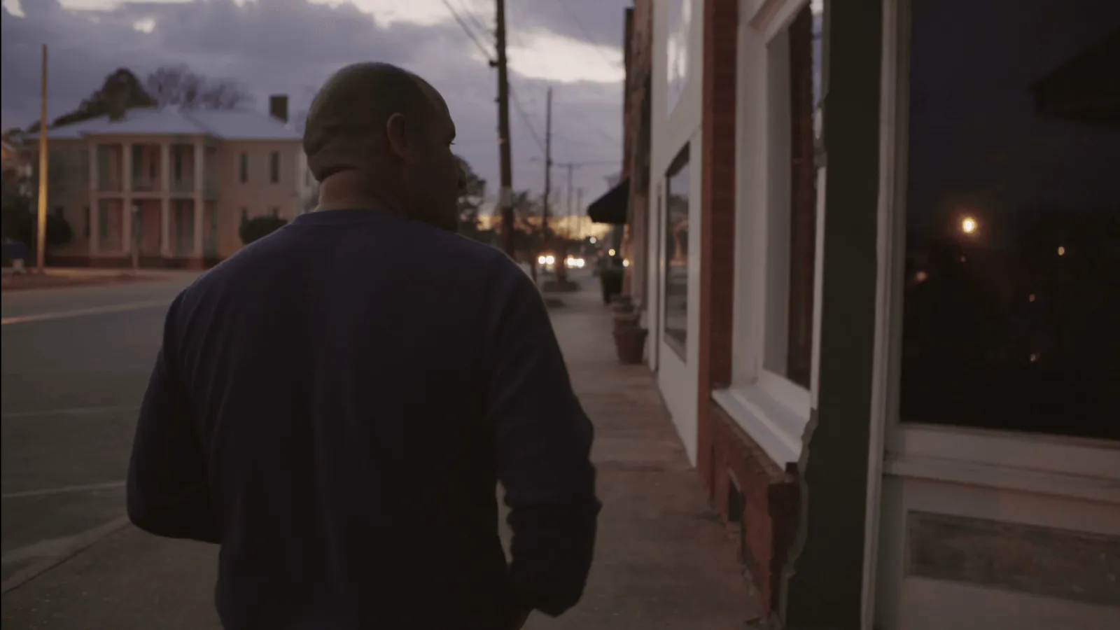 Film character Jorge walking around the town of Lumpkin, GA