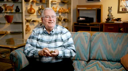 Kent Westbrook smiles in his artifact library. Photo courtesy of Bronson Crabtree.